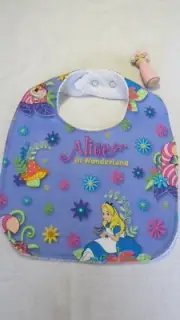 Handmade bib- Alice in Wonderland on purple