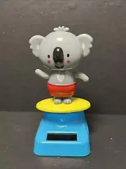 New Solar Powered Dancing Toy BobbleHead Summertime Koala On Surfboard - Red