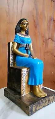 Queen Cleopatra sitting on her throne holding Ankh Key from Stone