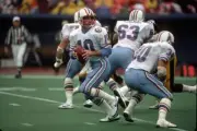 Quarterback Oliver Luck Houston Oilers drops back to pass against - Old Photo