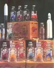 12 GALAXY SPACE FOODS SPACEMAN ASTRONAUT SODA SYRUP BOTTLE COIN BANKS 1953
