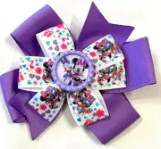 Beautiful Disney's Daisy Duck and Minnie Mouse inspired hair bow for girls.