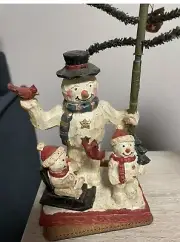 Snowmen Holding A Tree Figurine