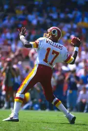 Quarterback Doug Williams Washington Redskins drops back to - Football Photo 16