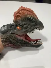 DILOPHOSAURUS DINOSAUR RUBBER HAND PUPPET. Realistic life like orange eyes.