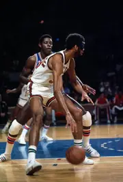 Kareem Abdul Jabbar Milwaukee Bucks dribbles the ball backing in - 1974 Photo 1