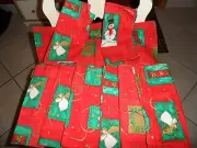set of 9 red and green Christmas cloth napkins with angels and snowmen