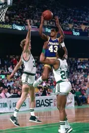 Terrence Stansbury Indiana Pacers goes up for a shot againt Larry - Old Photo