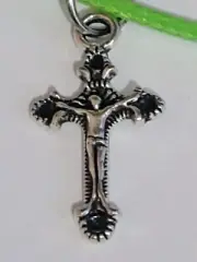 SILVER CROSS PENDANT ON GREEN LEATHER CORD, LOBSTER CLASP.