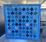 Handmade patchwork Quilt. Connected squares in blue (#115)
