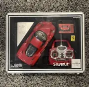 New Silverlit R/C Real Drive 1/16 Enzo Ferrari With Briefcase Sharper Image IN