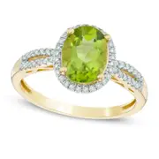 Oval Peridot and 0.20 CT. T.W. Natural Diamond Frame Ring in Solid 10K Yellow Gold