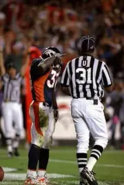 Running back Terrell Davis Denver Broncos performs the "Mile High - Old Photo