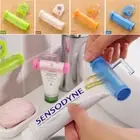 Bathroom Rolling Tube Toothpaste Squeezer Dispenser Tooth Paste Holder Plastic