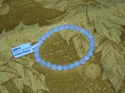 White Moonstone 2 1/2 inch 6 to 7 mm round beads on an elastic bracelet