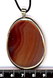 very large AGAT PENDANT, on black leather cord, silver framed