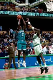 Larry Johnson Charlotte Hornets shoots over Xavier McDaniel Boston- Old Photo