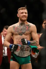 Conor McGregor after defeating Jose Aldo at UFC 194, 2015 12x8 Photo