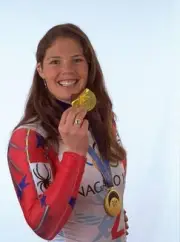 Picabo Street USA takes a bite of a chocolate gold medal as she we- Old Photo