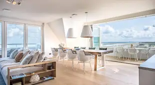 Super Luxe C-View appartement met zwembad en sauna op Duin aan Strand