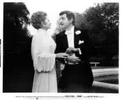 Robert Preston takes the arm of Lucille Ball in Mame 1974 Old Photo