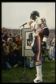 Running back Walter Payton Chicago Bears speaks to a crowd before - Old Photo