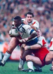 Sonny Nickle of St Helens is tackled by Kelvin Skerrett and Neil - Old Photo