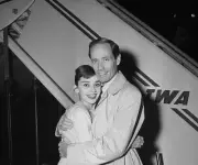 New York Screen star Audrey Hepburn appears overjoyed to be reuni- 1956 Photo