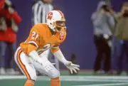 Cornerback John Holt Tampa Bay Buccaneers looks on from the field - Old Photo