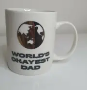 WORLDS OKAYEST DAD CUP MUG, GOLD METALLIC WORLD PRINT, NEW IN BOX