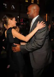 Actress Mila Kunis producer Broderick Johnson arrive at "The Book - Old Photo