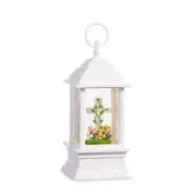 snow globe with cross in a bed of tulips,