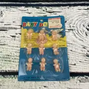Vtg unopened package of 9 Miniature sitting Babies Toy Dollhouse Famus B-1324