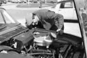 Topping up the oil on a Ford straight six engine 1963 Rally Car Racing Old Photo