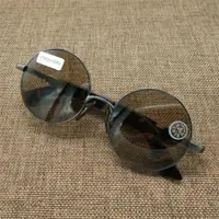 在飛比找ETMall東森購物網優惠-天然水晶眼鏡 老料茶白水晶復古圓形太陽眼鏡墨鏡女防紫外線輻射