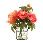 Pink peonies in glass jar with metal handle