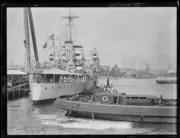 Tugboat near the H.M.A.S. Albatross as she departs NSW 13 April 1929 Old Photo