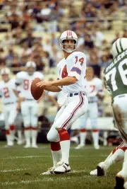 Quarterback Steve Grogan New England Patriots drops back to pass - 1974 Photo