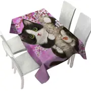 Cute Black and White Kitten Cat on Cherry Blossom Tablecloth
