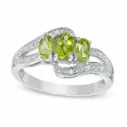 Oval Peridot and White Topaz Three Stone Bypass Ring in Sterling Silver