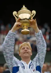 Boris Becker of West Germany holds aloft the trophy for the Wimbl - Old Photo 1