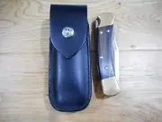 Buck 110 custom leather knife sheath. Skull and crossbones snap. Sheath only
