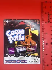 ONE COCOA PUFFS FLAVORED CHOCOLATE LIP BALM TASTE BEAUTY CHAPSTICK .12oz