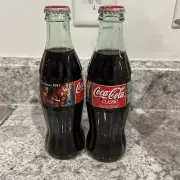 Christmas 1997 2 COCA-COLA BOTTLES 8OZ.