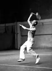 Tennis Tom Jeffery smashes the ball during practice at the Empire - Old Photo