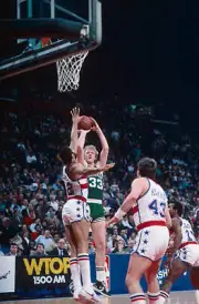 Boston Celtics' forward Larry Bird shoots 1980's Basketball photo