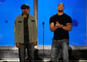 Actors Samuel L. Jackson Dwayne 'The Rock" Johnson speak onstage a- Old Photo 1