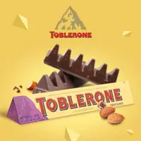 在飛比找momo購物網優惠-【TOBLERONE】瑞士三角牛奶巧克力含葡萄堅果及蜂蜜及奶