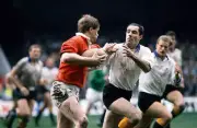Trevor Ringland of the British Lions is challenged by Patrick Est - Old Photo