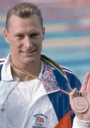 Nick Gillingham of Great Britain celebrates after receiving the br- Old Photo